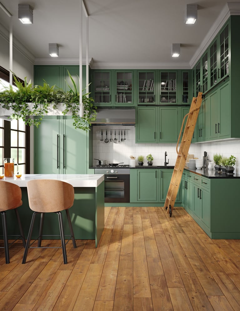Green kitchen with white countertops and hanging plants