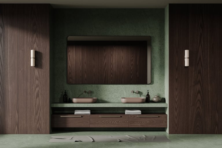 Modern bathroom with green stone walls and dark wood cabinetry